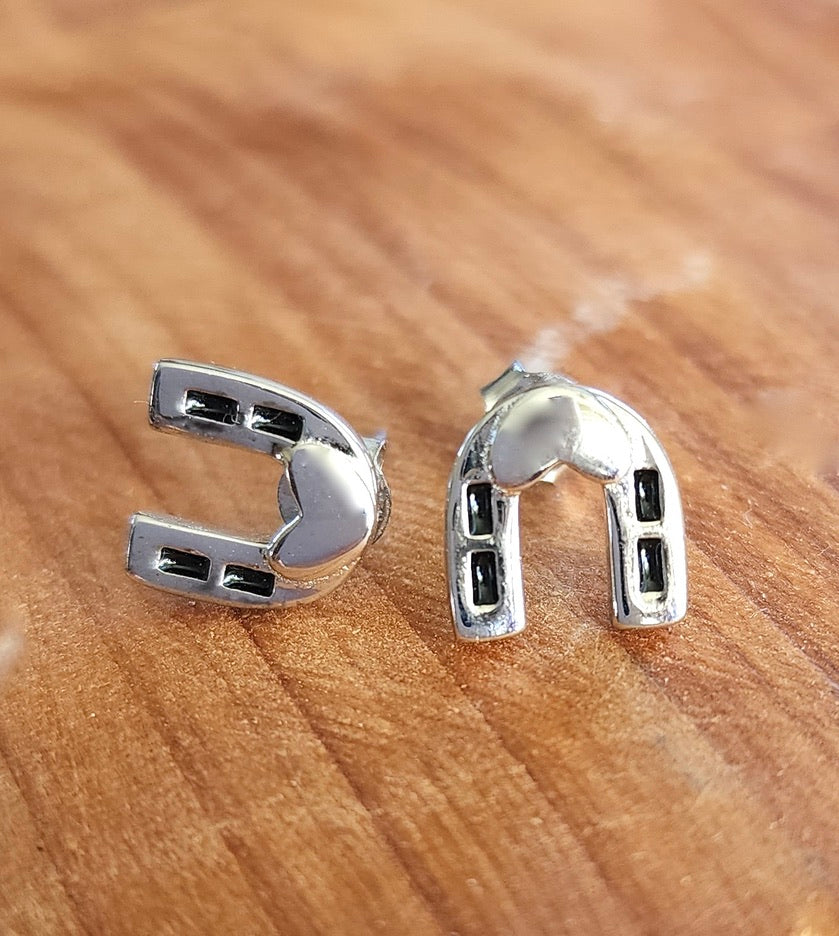 Dark Horse Horseshoe Stud Earrings - These silver stud earrings feature a unique horseshoe design